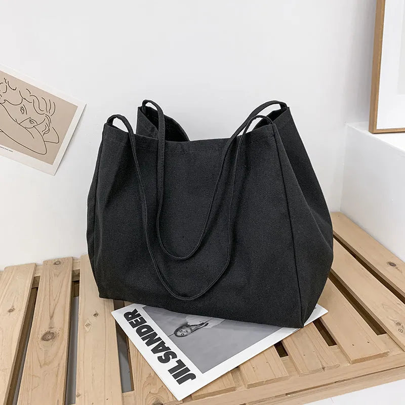 Solid colour women's canvas handbag with double shoulder straps and mobile phone compartment