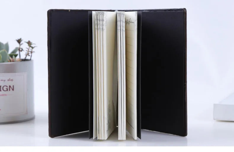 Embossed retro hardcover notebook with PU leather cover, bronze relief highlights, 13.5x20.5cm beige paper, 180-degree spreadable binding