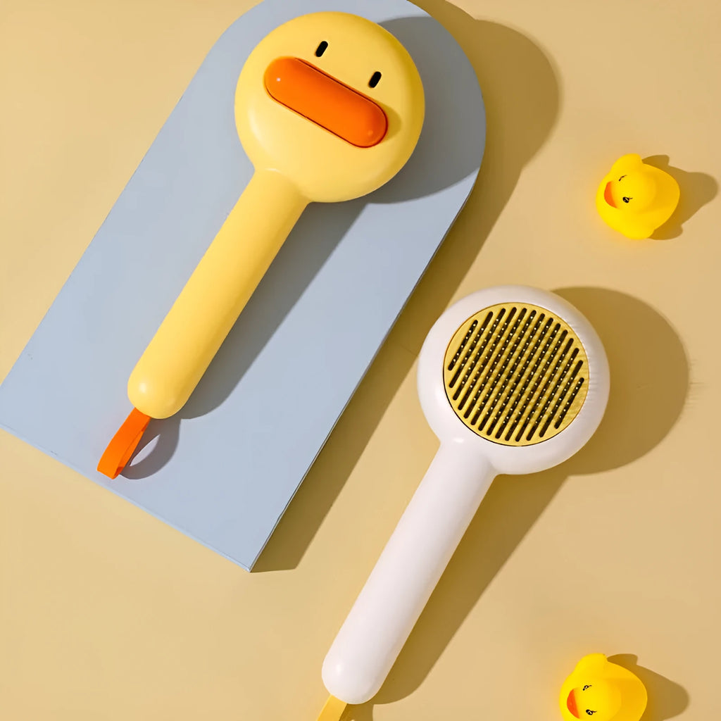 Small yellow duck comb for pet grooming with needle teeth and open section design