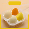 Four makeup sponges 60x40mm diagonal cut in avocado green, mango, strawberry mousse, and grape colours