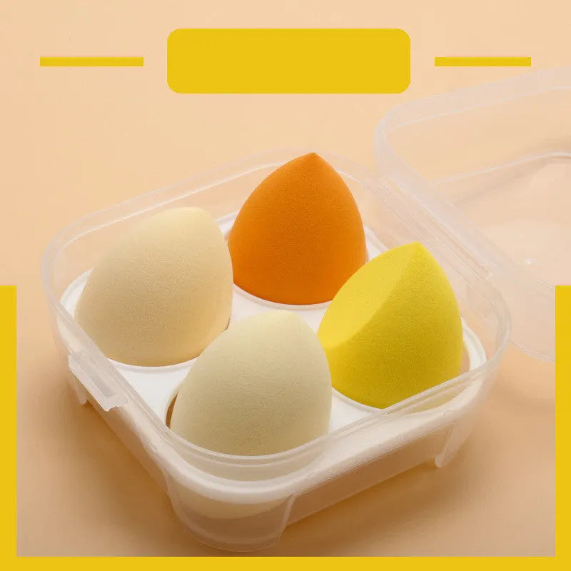 Four makeup sponges 60x40mm diagonal cut in avocado green, mango, strawberry mousse, and grape colours