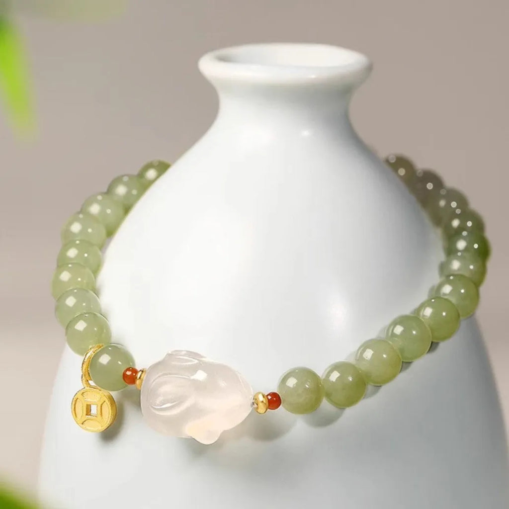 Handmade glass rabbit charm bracelet for women with coloured glaze details