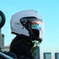 Summer motorcycle half helmet with double visor in matte black finish on light background