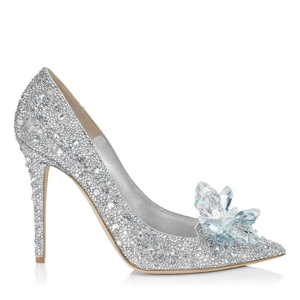 Gold women's stiletto high heels with rhinestone decoration and a pointed toe.