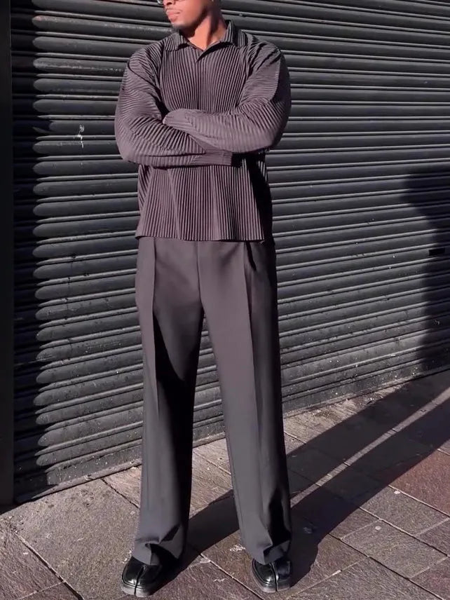 Black men's long-sleeved casual shirt with a pleated design detail on the front.