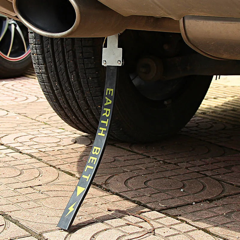 Black car electrostatic grounding belt, 37cm long with metal hook, shown against a vehicle tyre.