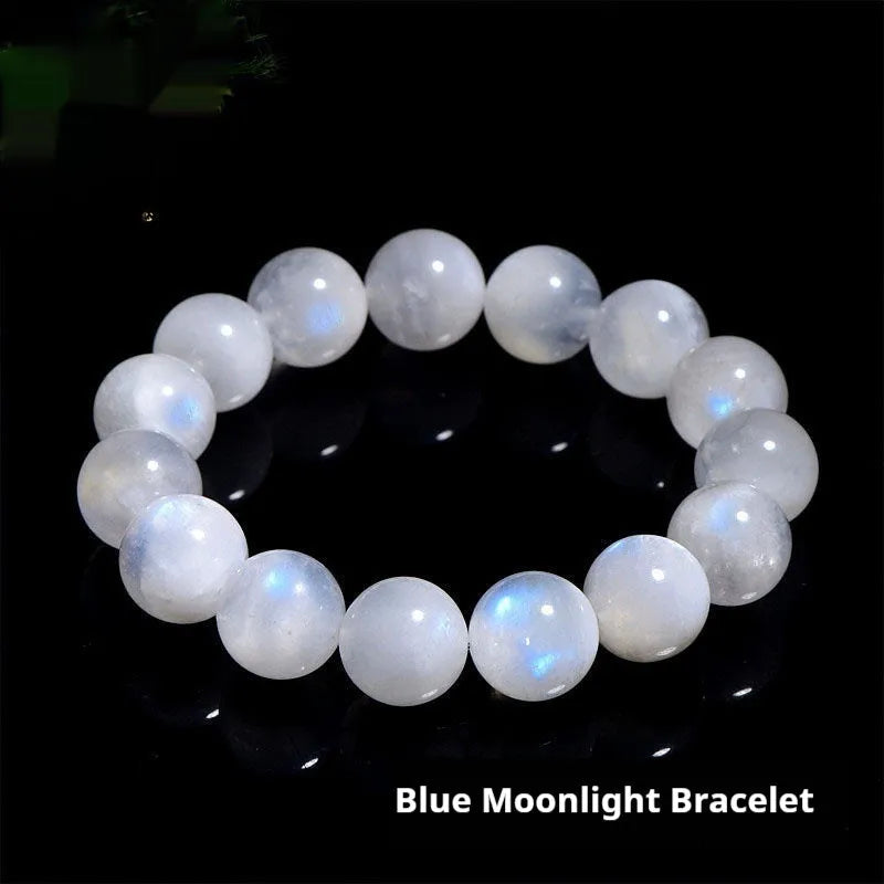 Natural blue and white polished moonstone round bead bracelet on a white background.