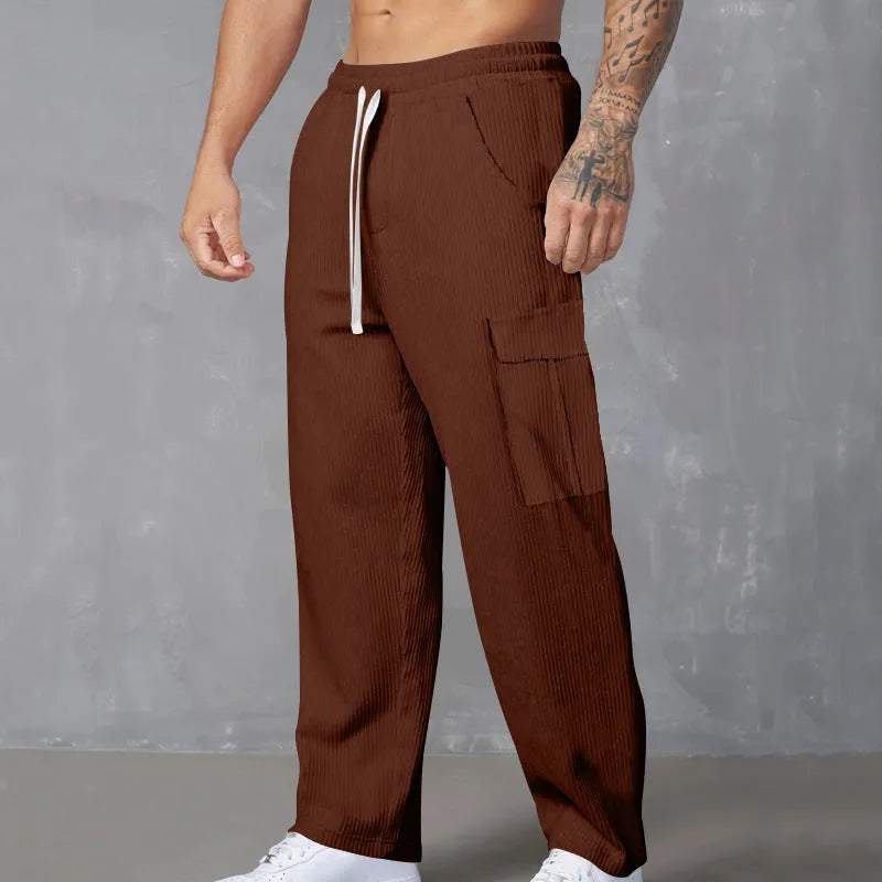 Men's straight-leg corduroy trousers in navy blue with an elasticated drawstring waist.