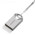 Small silver and black metal USB flash drive on a white background