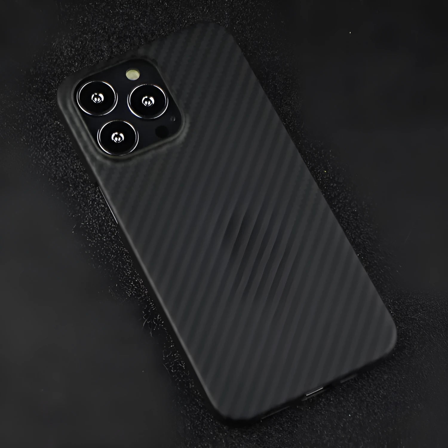 Kevlar fibre iPhone case with MagSafe magnetic charging compatibility in dull black Volcanic Crater pattern
