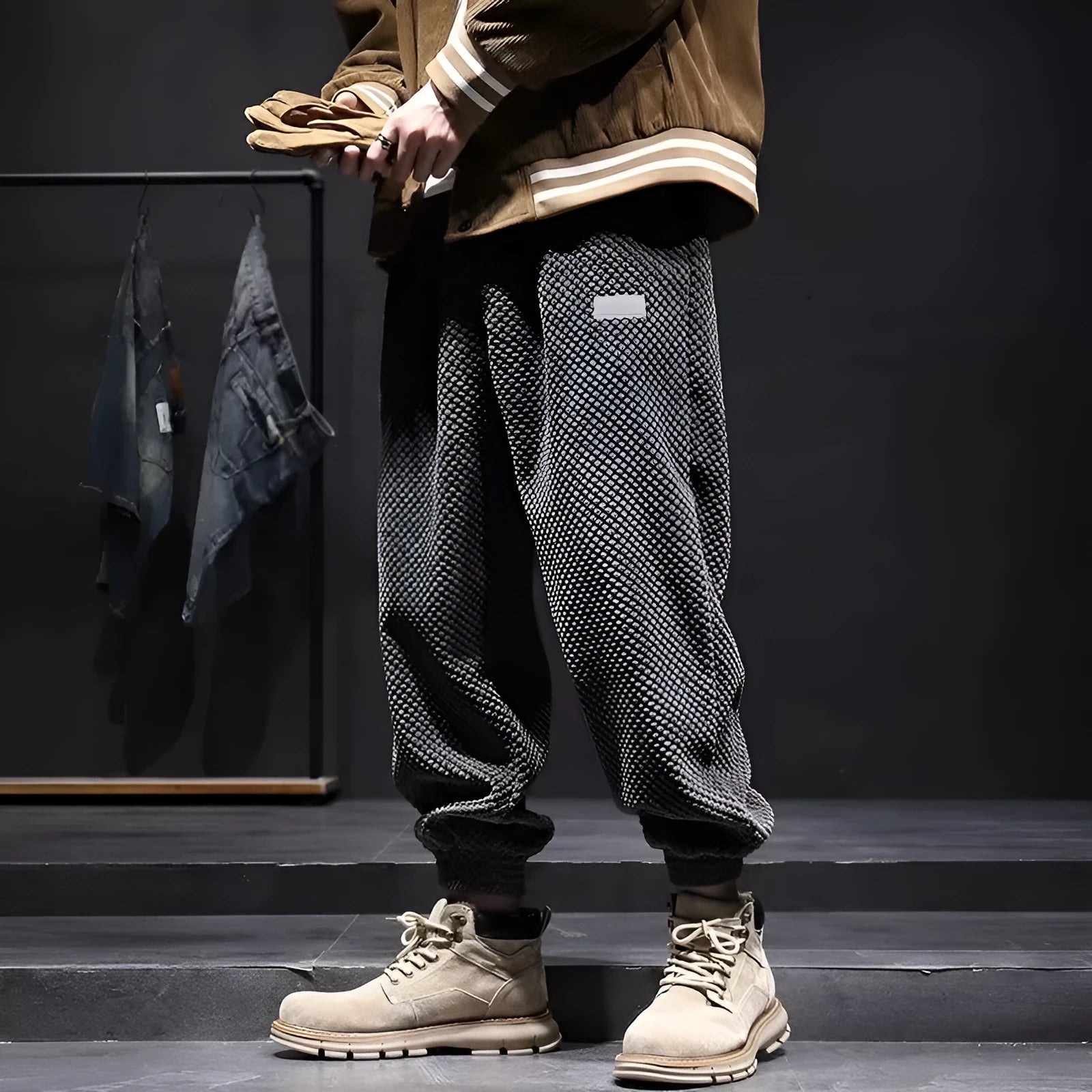 Grey men's sweatpants with ankle ties and a straight leg cut on a neutral background.