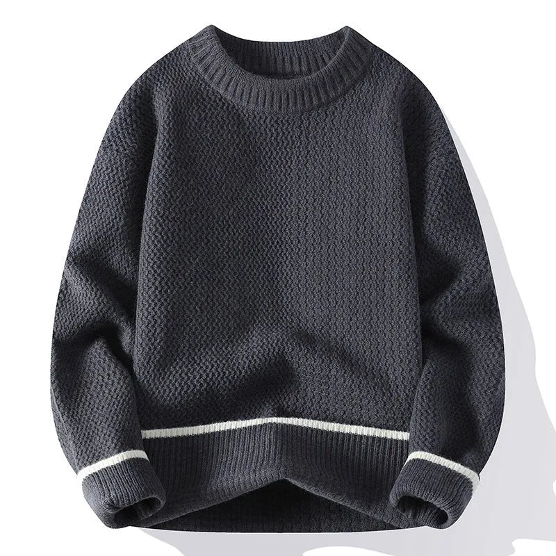 Man wearing a grey loose-fit round neck men's pullover sweater.