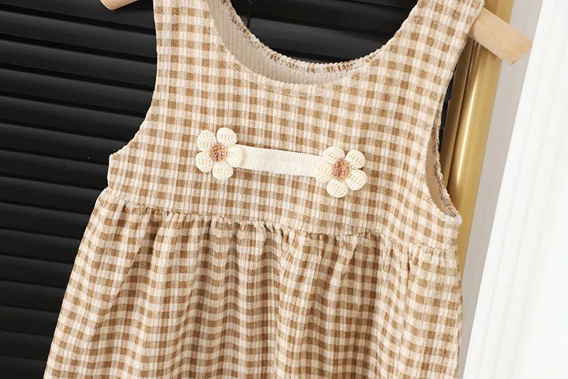 Baby girl wearing a dark coffee plaid Korean style long-sleeved dress suit set, comprising a shirt and dress.