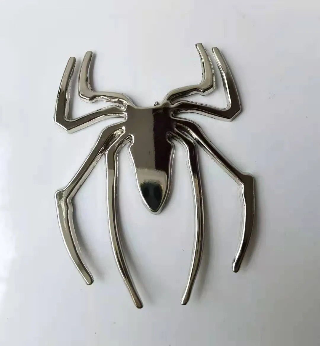 3D metal spider bumper sticker in gold on a car bumper