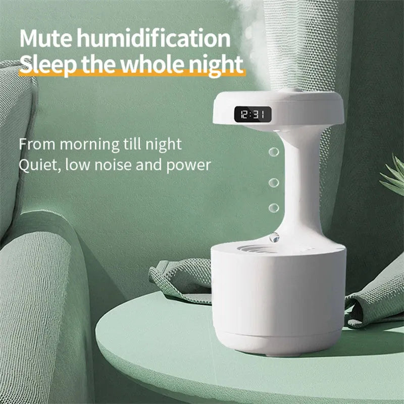 White columnar anti-gravity humidifier on a desk with LED clock display and visible mist.