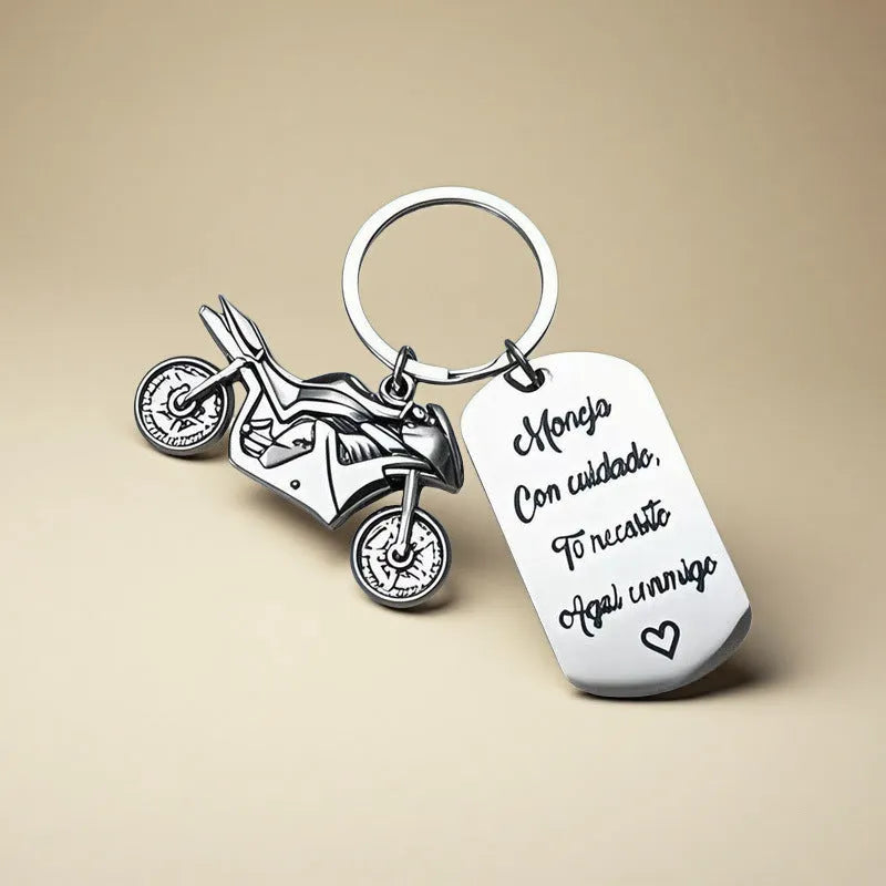 Stainless steel motorcycle keychain with minimalist design in a flannel gift bag.