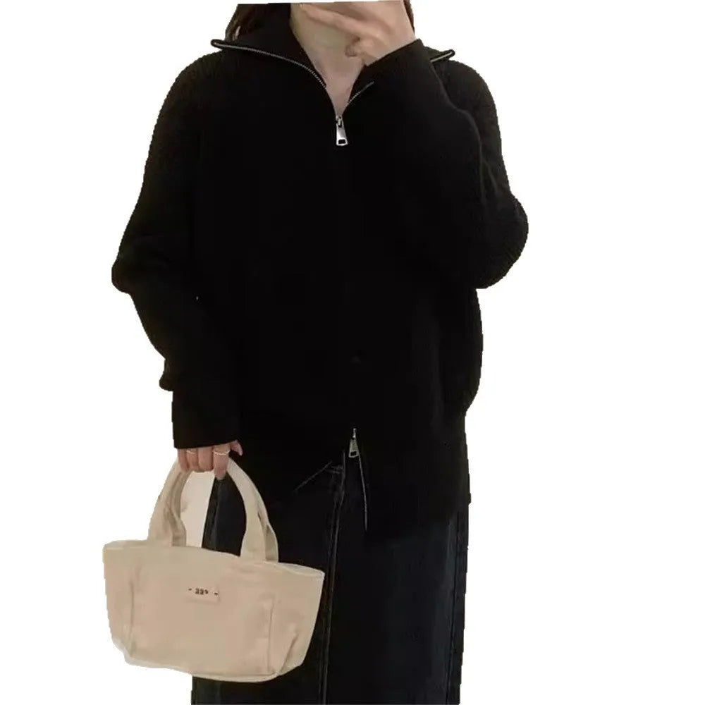 Hong Kong style grey double zipper knitted cardigan jacket on a hanger
