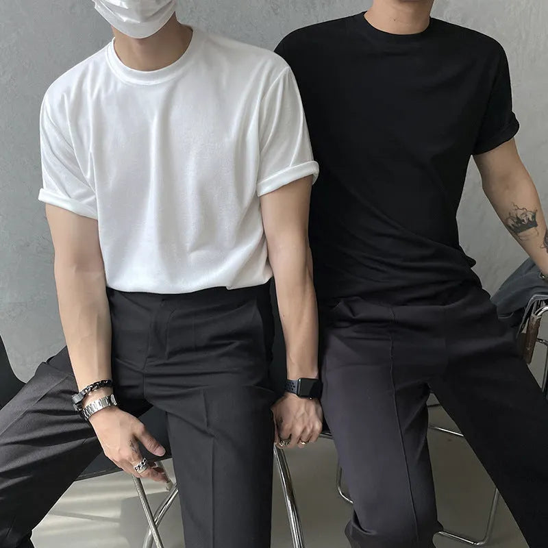 Men's slim fit cotton t-shirt in black on a hanger, showing round neck and short sleeve.
