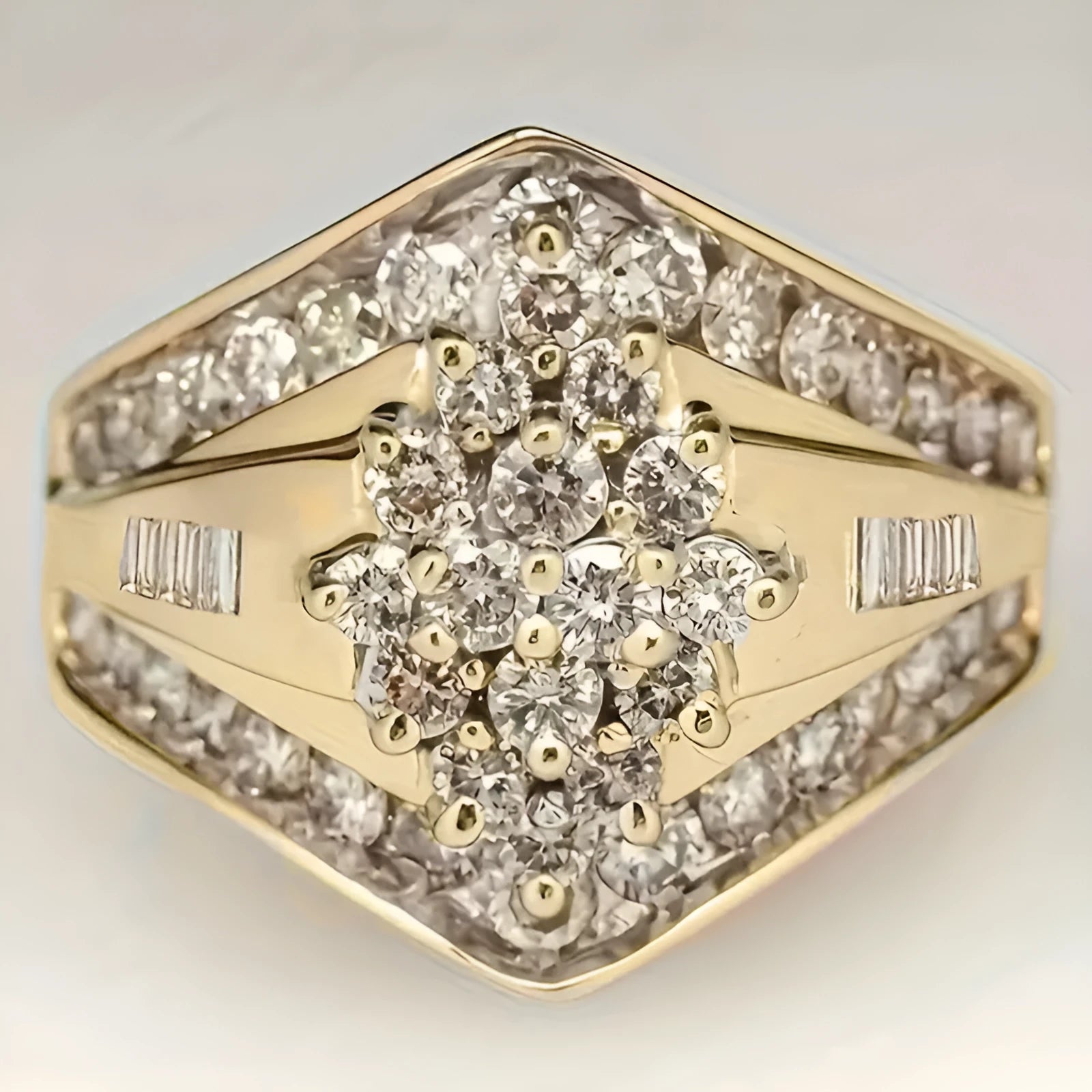 Geometric gold-coloured copper palace style ring on a plain background.