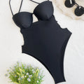Black women's one-piece swimsuit with bikini style design