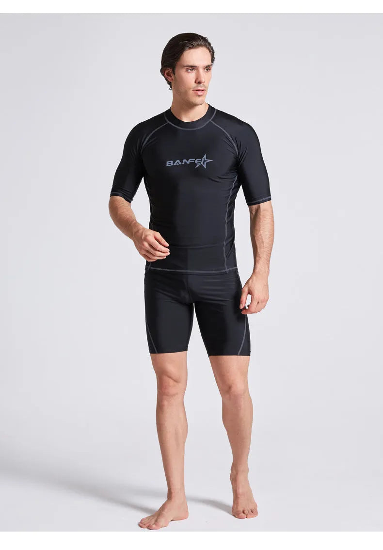 Men's half sleeve nylon swim suit top and pants set on a white background