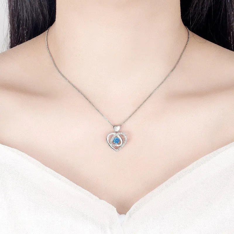 Blue diamond heart pendant necklace and matching bracelet jewellery set with gem inlay on electroplated copper