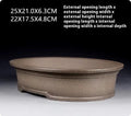 Handmade antique oval bonsai flower pot made from purple sand clay, dimensions 25x21x6.3 cm.