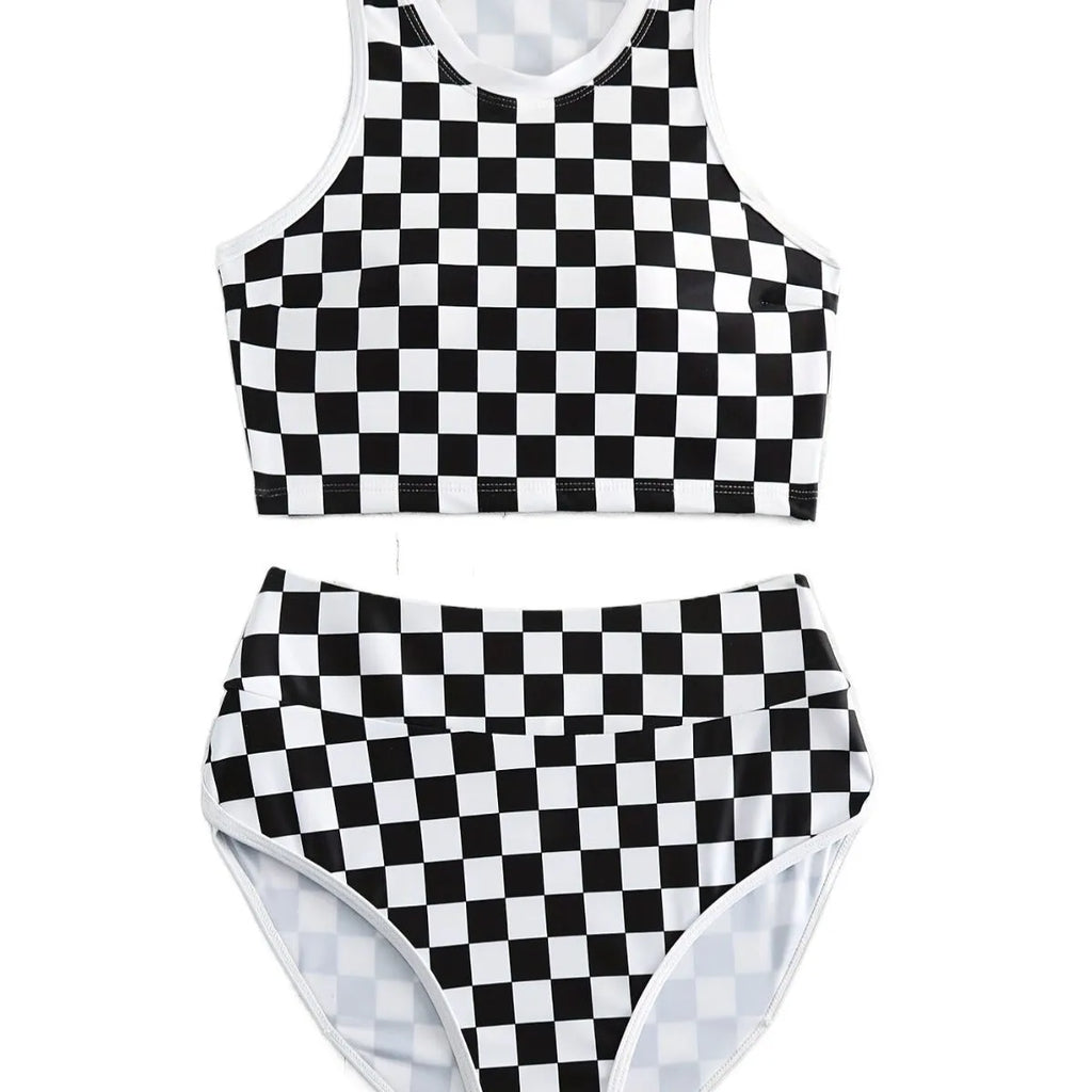 Women's backless one-piece swimsuit with black and white chessboard pattern and sporty suspender straps.