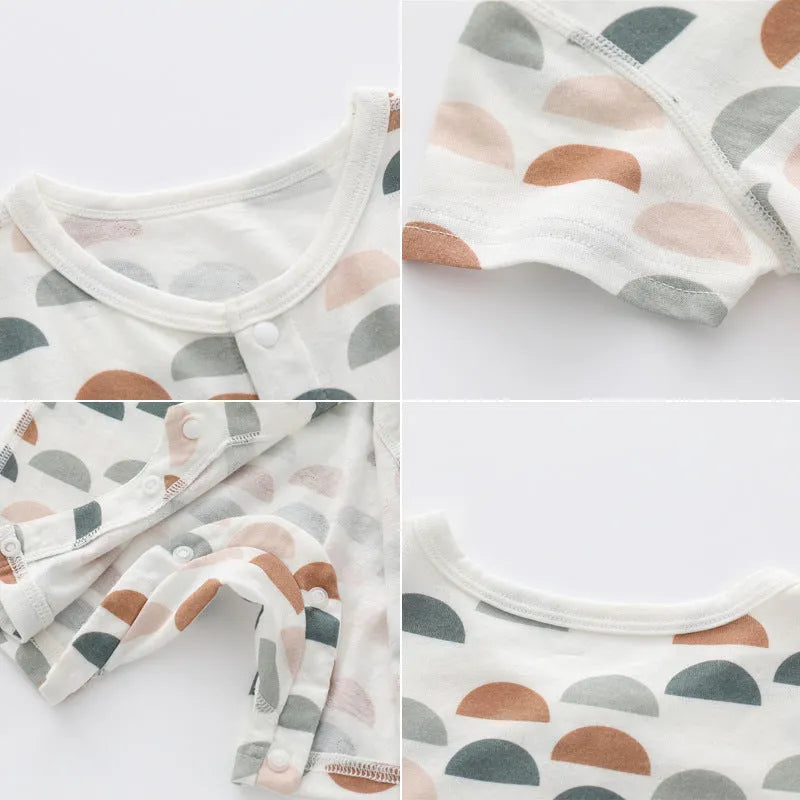 Baby wearing a soft bamboo fibre jumpsuit with a cute Nordic animal print, long sleeves.