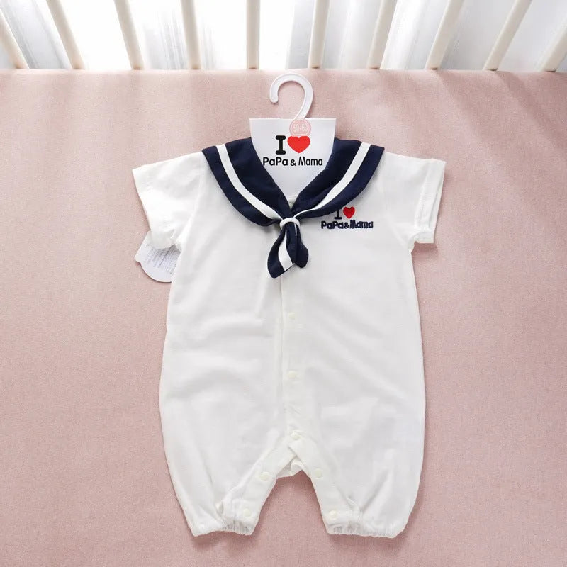 Navy blue Japanese style baby bodysuit with long sleeves and a detachable hood laid flat.