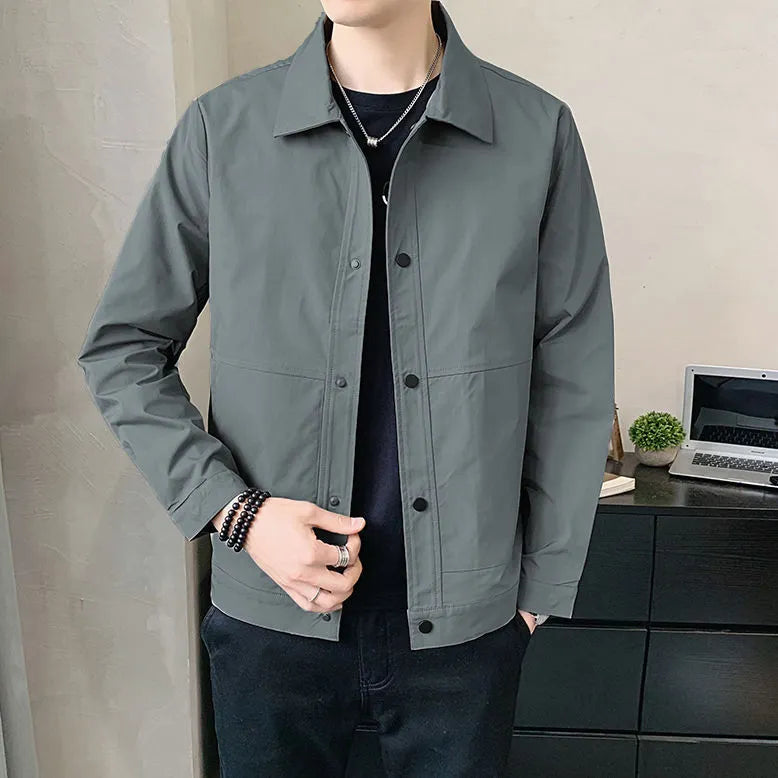 Man wearing a thin, single-layer Korean style jacket in light gray for spring or autumn.