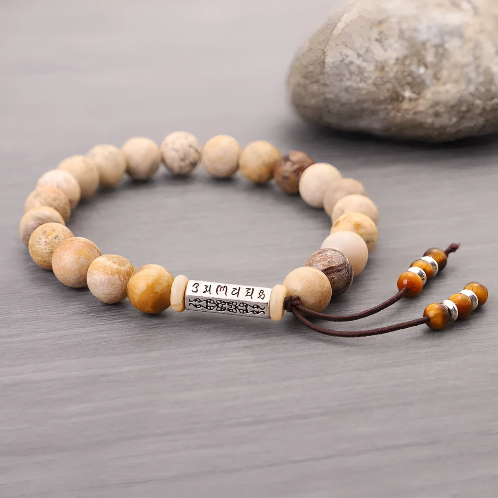 Handmade wood colour stone bead bracelet with adjustable closure on wooden background