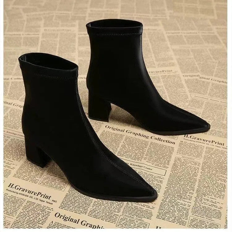 Women's khaki pointed toe Martin boots with a wedge heel on a white background.