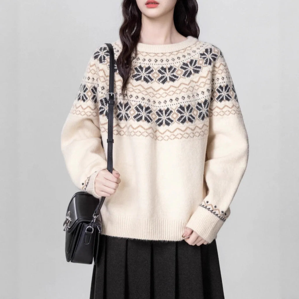 Women's loose-fit Milky White Fair Isle knitted pullover sweater on a hanger, showing geometric pattern and thick lambswool blend fabric.