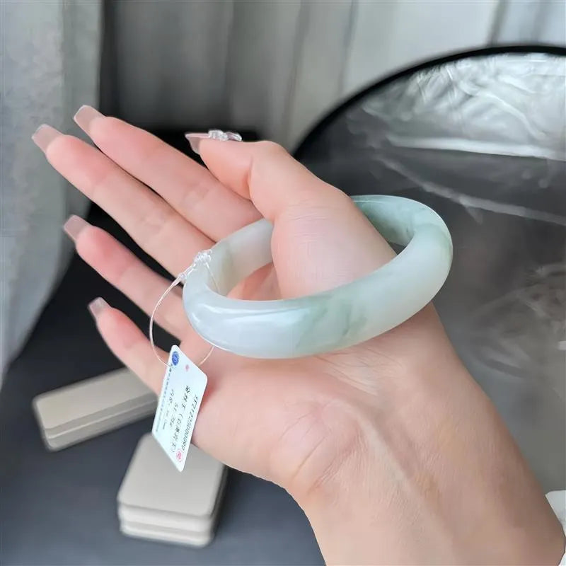Tian Shan Cui bracelet with ice-like floating flowers design and animal zodiac charm