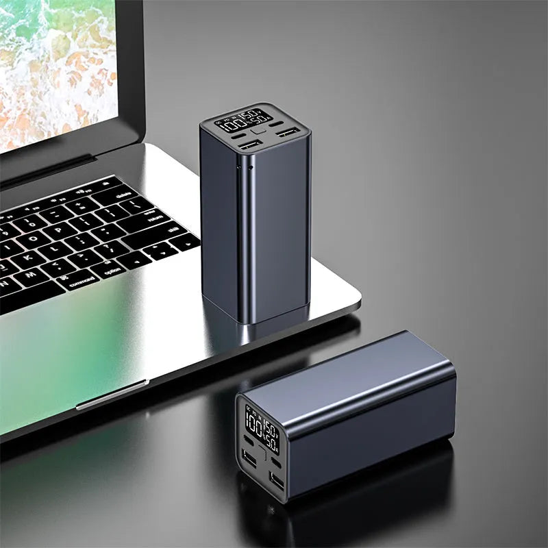 Black high-power 65W laptop charging bank with USB-C port, showing dimensions of 47.5x104.5x47.5mm.