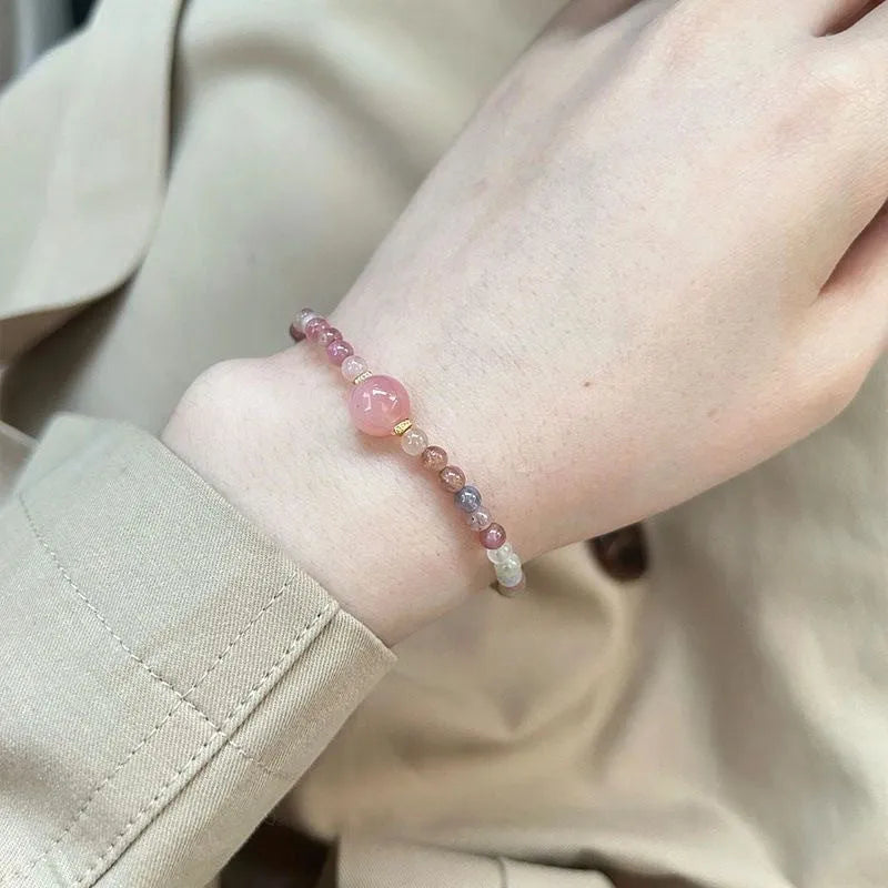 Women's pink crystal and electroplated alloy bracelet with geometric shapes in one of eight colour options.