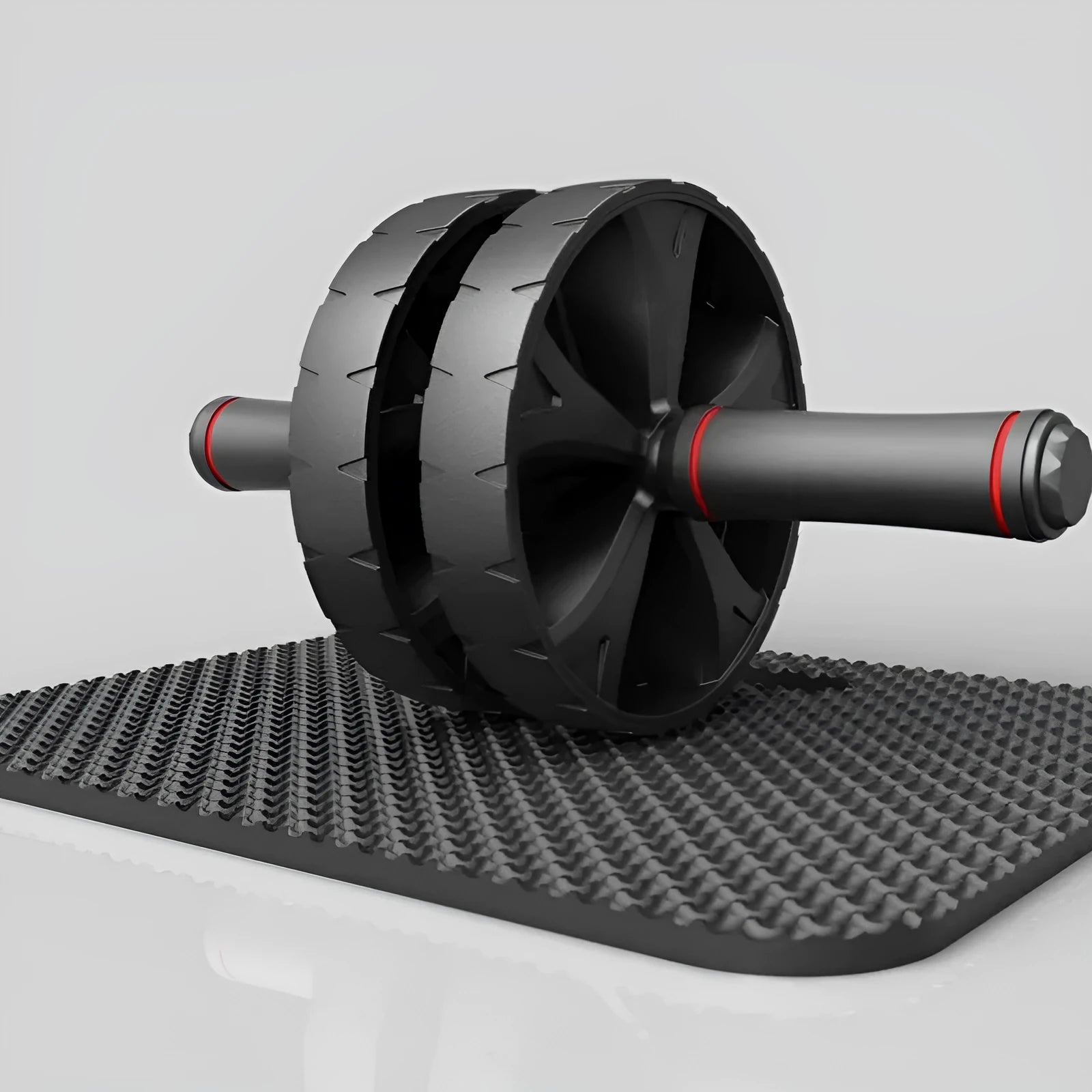 Black rebound abdominal roller with rubber wheel on a white background
