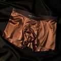 Men's solid colour ice silk seamless underwear shown in various colours including white, brown, gray, and blue.