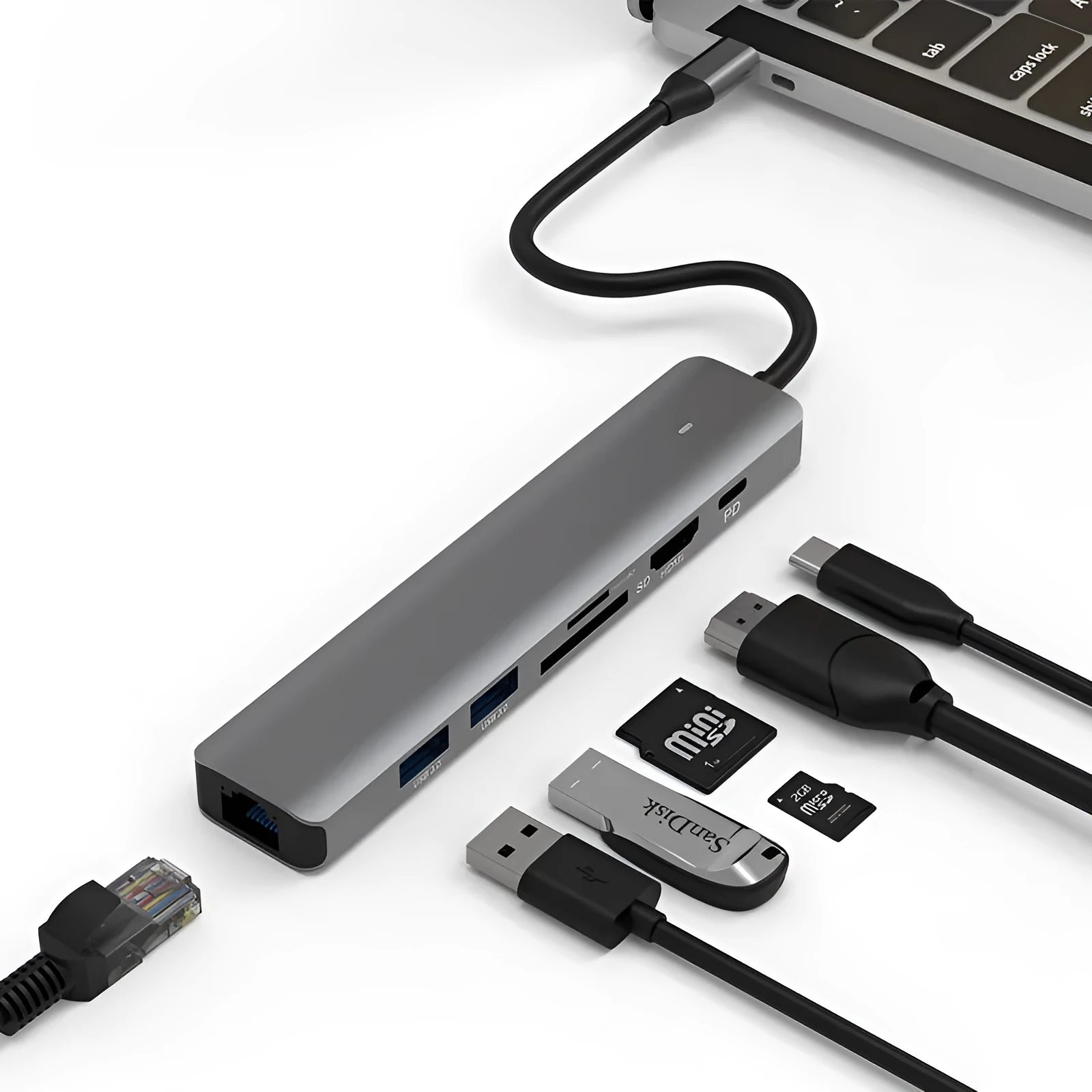 LQT-LH07 7-in-1 USB-C card reader and computer hub on a desk next to a laptop.