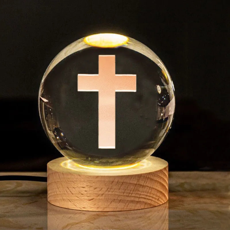 White crystal ball desk lamp with warm light on a solid wood base.