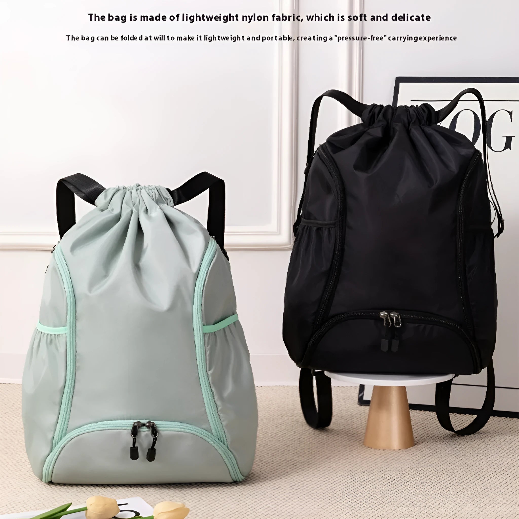 Large black cube-shaped sports backpack with a drawstring top closure, shown on a neutral background.