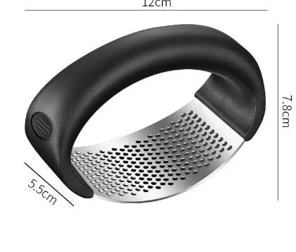 Stainless steel garlic press with coloured ergonomic handle on a kitchen counter.