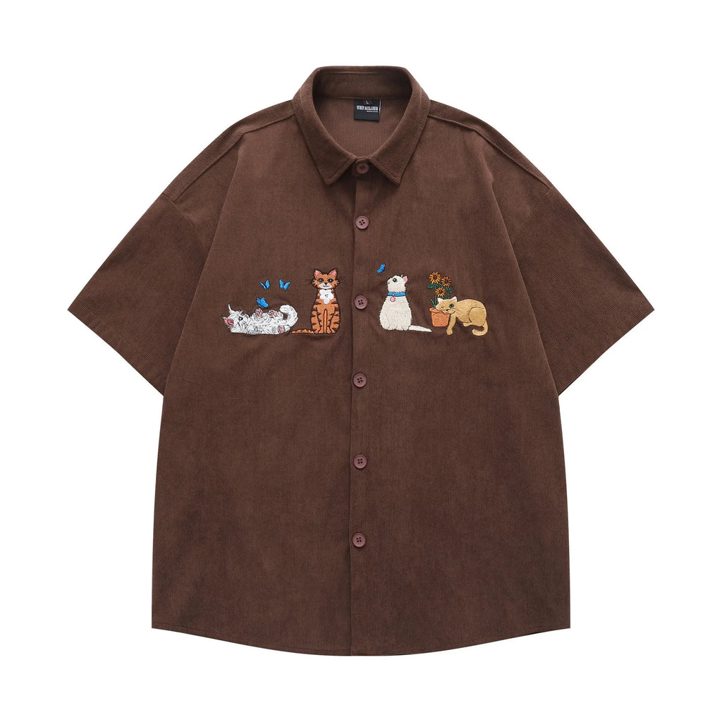 Loose apricot cardigan shirt with cartoon embroidery detail on the front