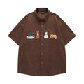 Loose apricot cardigan shirt with cartoon embroidery detail on the front