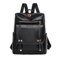 Retro brown PU leather women's backpack with front pockets and top handle.