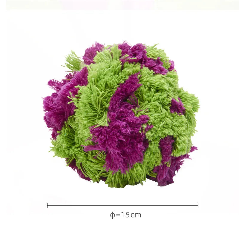 Purple sea urchin plush dog chew ball with multiple protruding sections for teething relief
