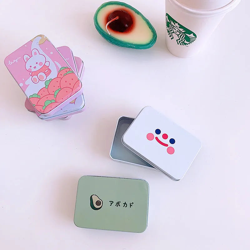 Small iron craft storage tin with colourful printed design measuring 9.5cm long