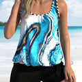 Blue tie-dye floral pattern on a women's two-piece swimsuit with separate top and shorts.