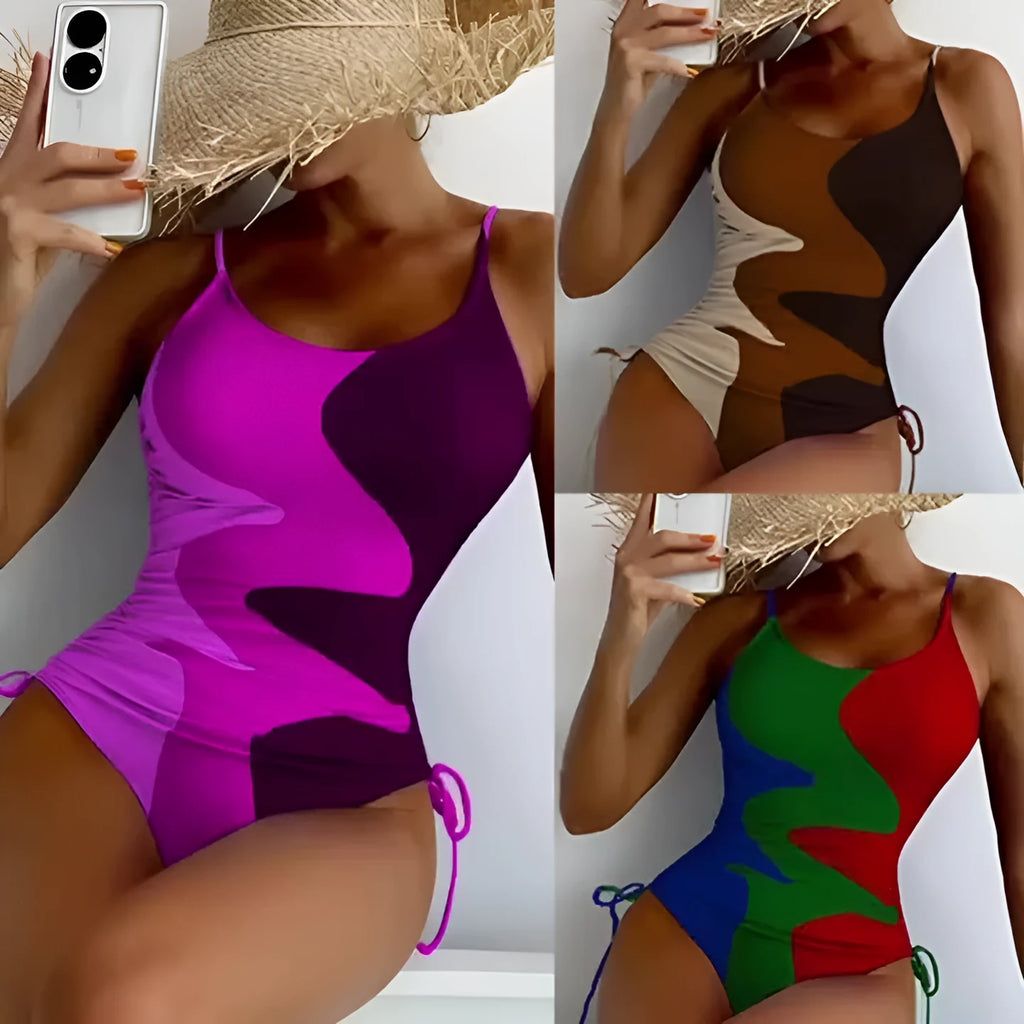 Women's blue sleeveless backless one-piece swimsuit with a striped print on a mannequin.